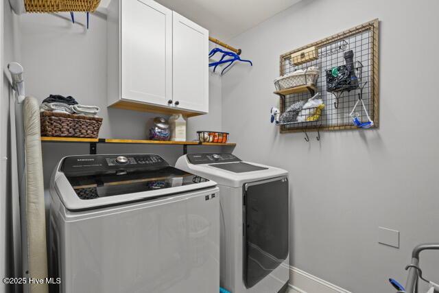 400 Lanyard Dr, Newport, NC 28570 - laundry area with cabinet space and washing machine and clothes dryer
