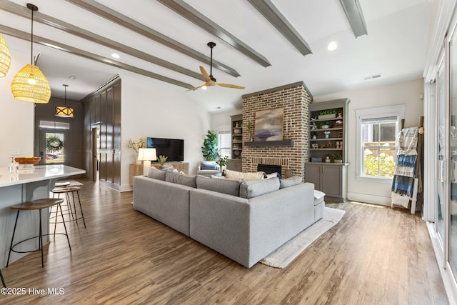 1112 Winged Seed Way, Wilmington, NC 28409 - living room with a ceiling fan, a fireplace, wood finished floors, plenty of natural light, and recessed lighting