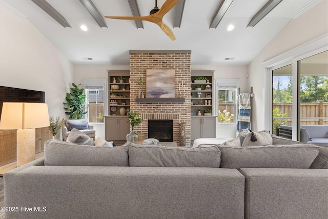 1112 Winged Seed Way, Wilmington, NC 28409 - living room featuring ceiling fan, lofted ceiling, a fireplace, recessed lighting, and wood finished floors