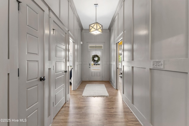 1112 Winged Seed Way, Wilmington, NC 28409 - doorway featuring light wood-style flooring and a decorative wall