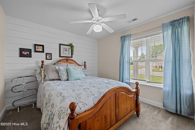 102 Bandon Dr, New Bern, NC 28562 - bedroom featuring light colored carpet, ceiling fan, and wood walls
