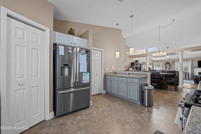 102 Bandon Dr, New Bern, NC 28562 - kitchen with appliances with stainless steel finishes, open floor plan, a peninsula, decorative columns, and decorative light fixtures