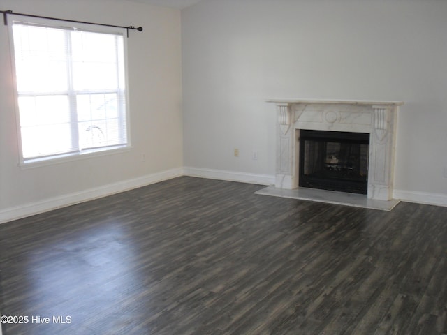 124 Pella Ln, New Bern, NC 28562 - unfurnished living room with dark wood-type flooring, healthy amount of natural light, and a premium fireplace