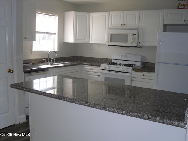 124 Pella Ln, New Bern, NC 28562 - kitchen featuring white appliances, white cabinets, dark stone countertops, and dark wood-style flooring