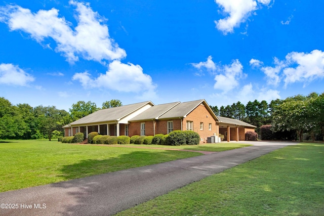 3509 Lakeview Trl, Kinston, NC 28504 - single story home with brick siding, asphalt driveway, and a front lawn