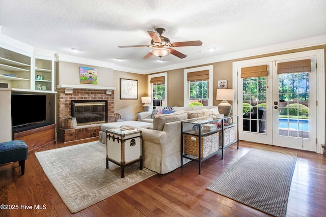 3509 Lakeview Trl, Kinston, NC 28504 - living area with french doors, a ceiling fan, a textured ceiling, ornamental molding, and wood finished floors
