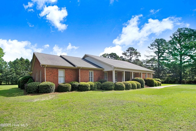 3509 Lakeview Trl, Kinston, NC 28504 - view of side of property with brick siding and a lawn