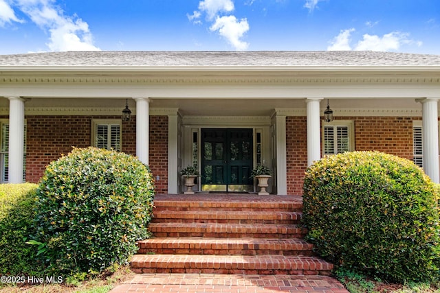 3509 Lakeview Trl, Kinston, NC 28504 - property entrance with brick siding, covered porch, and roof with shingles