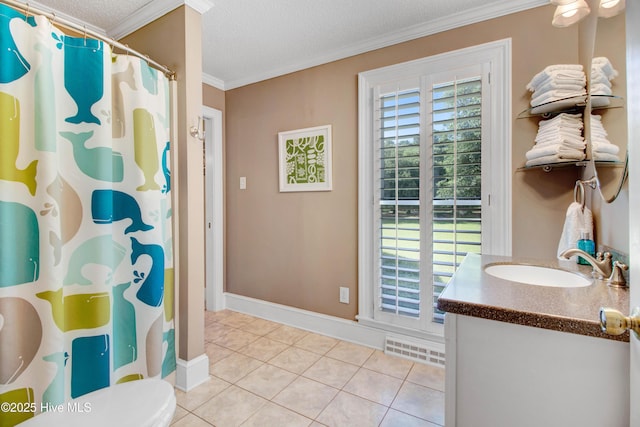 3509 Lakeview Trl, Kinston, NC 28504 - full bath with vanity, a textured ceiling, crown molding, tile patterned flooring, and plenty of natural light