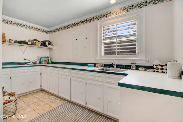 3509 Lakeview Trl, Kinston, NC 28504 - kitchen with open shelves, white cabinets, light tile patterned floors, ornamental molding, and light countertops