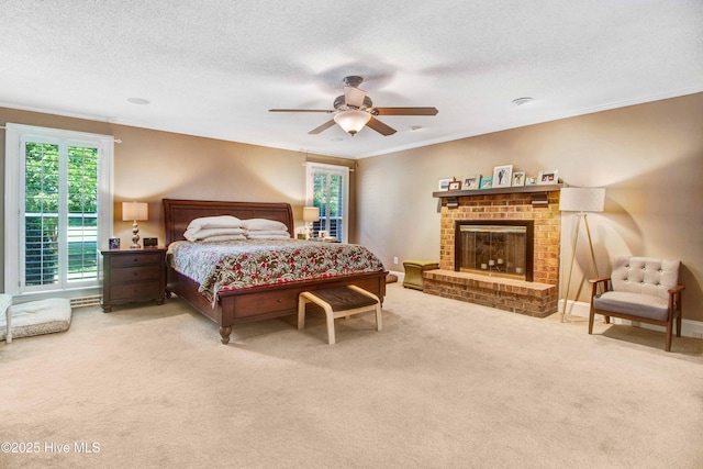 3509 Lakeview Trl, Kinston, NC 28504 - bedroom with ornamental molding, carpet flooring, multiple windows, a fireplace, and a textured ceiling