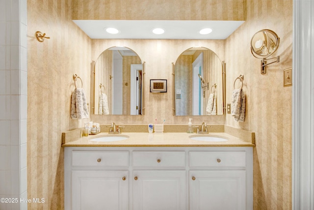 3509 Lakeview Trl, Kinston, NC 28504 - bathroom featuring wallpapered walls and double vanity