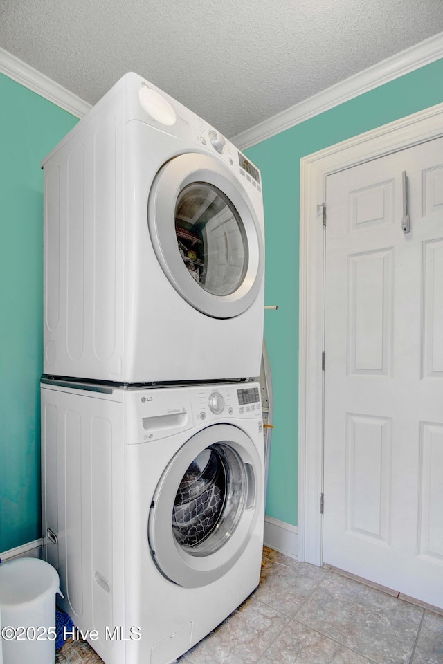 3509 Lakeview Trl, Kinston, NC 28504 - laundry room with stacked washer / drying machine, crown molding, and a textured ceiling