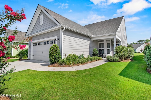 1105 Snowden Rd, Wilmington, NC 28412 - view of front of property featuring roof with shingles, a front yard, driveway, and a garage