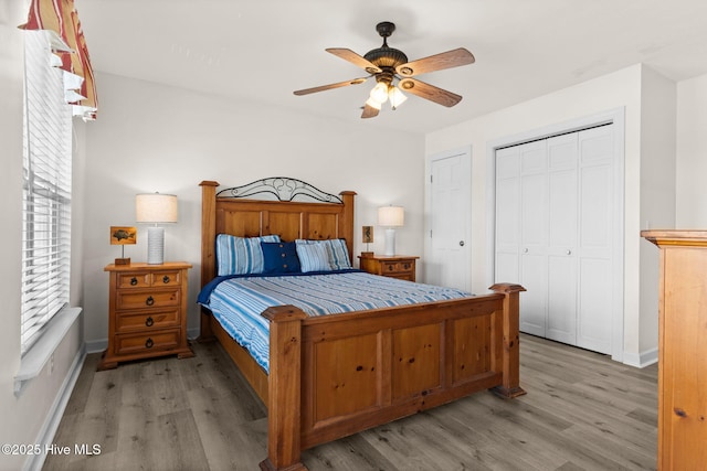 533 Ocean Blvd W, Holden Beach, NC 28462 - bedroom with wood finished floors, ceiling fan, and a closet
