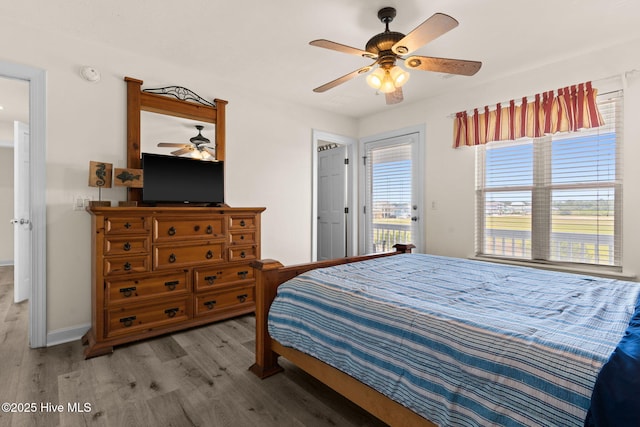 533 Ocean Blvd W, Holden Beach, NC 28462 - bedroom featuring wood finished floors, access to exterior, and a ceiling fan
