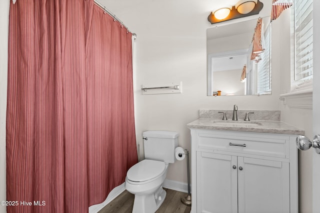 533 Ocean Blvd W, Holden Beach, NC 28462 - full bath featuring vanity, wood finished floors, and a shower with shower curtain