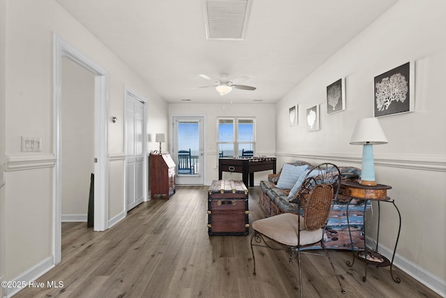 533 Ocean Blvd W, Holden Beach, NC 28462 - living area featuring wood finished floors and a ceiling fan