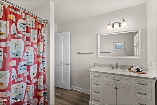 533 Ocean Blvd W, Holden Beach, NC 28462 - full bathroom with vanity, wood finished floors, and a shower with shower curtain