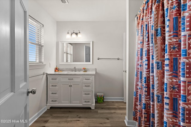 533 Ocean Blvd W, Holden Beach, NC 28462 - full bath with wood finished floors and vanity
