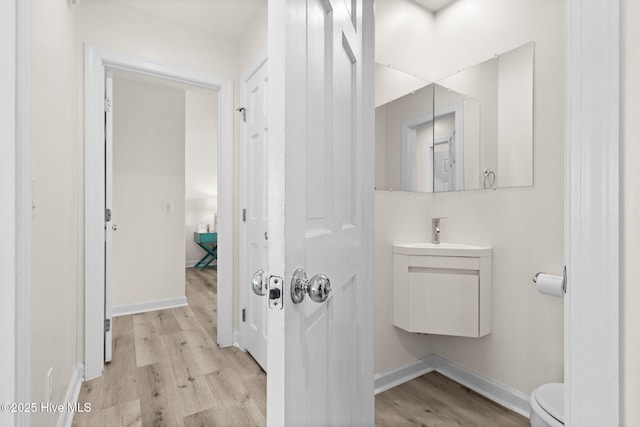 533 Ocean Blvd W, Holden Beach, NC 28462 - bathroom with wood finished floors and vanity