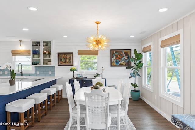 15 Coral Dr, Wrightsville Beach, NC 28480 - dining area with plenty of natural light, dark wood finished floors, a chandelier, recessed lighting, and ornamental molding