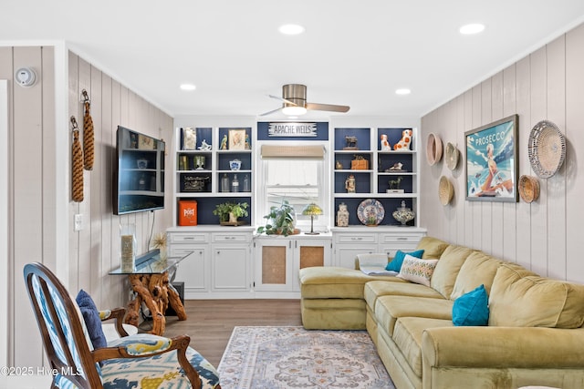 15 Coral Dr, Wrightsville Beach, NC 28480 - living room featuring wood finished floors, crown molding, wooden walls, recessed lighting, and a ceiling fan