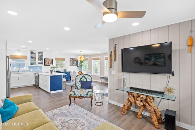 15 Coral Dr, Wrightsville Beach, NC 28480 - living area with wood finished floors, recessed lighting, and a ceiling fan