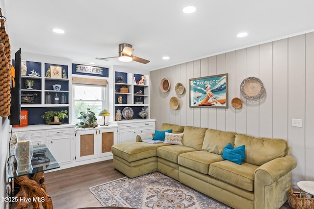 15 Coral Dr, Wrightsville Beach, NC 28480 - living room featuring dark wood-type flooring, ceiling fan, recessed lighting, and ornamental molding