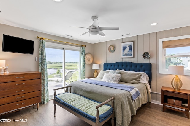 15 Coral Dr, Wrightsville Beach, NC 28480 - bedroom with multiple windows, wood finished floors, a ceiling fan, and recessed lighting