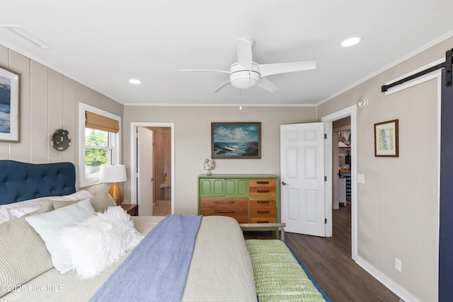 15 Coral Dr, Wrightsville Beach, NC 28480 - bedroom featuring crown molding, dark wood-type flooring, a barn door, recessed lighting, and a ceiling fan