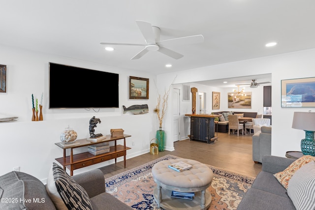 15 Coral Dr, Wrightsville Beach, NC 28480 - living room featuring ceiling fan, recessed lighting, wood finished floors, and a chandelier