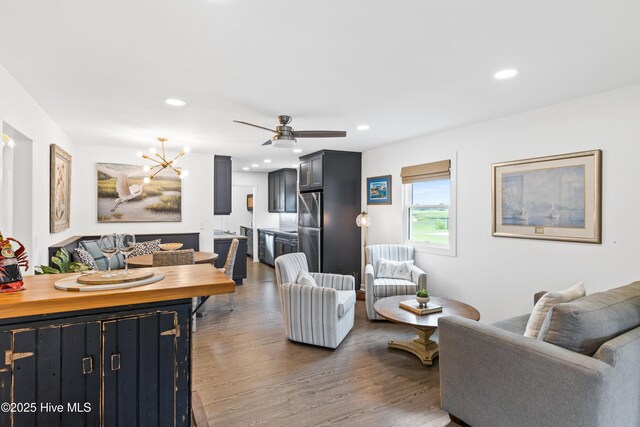 15 Coral Dr, Wrightsville Beach, NC 28480 - living area featuring a chandelier, recessed lighting, wood finished floors, and ceiling fan