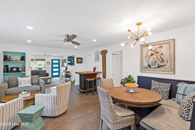 15 Coral Dr, Wrightsville Beach, NC 28480 - dining room featuring wood finished floors, recessed lighting, a chandelier, and a ceiling fan