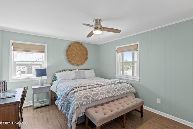 15 Coral Dr, Wrightsville Beach, NC 28480 - bedroom with multiple windows, wood finished floors, ornamental molding, and ceiling fan
