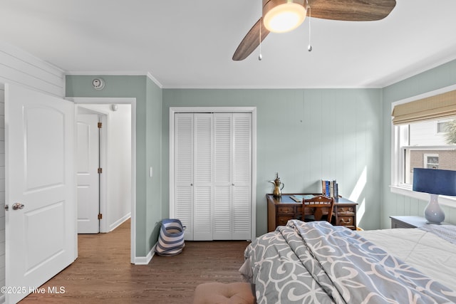 15 Coral Dr, Wrightsville Beach, NC 28480 - bedroom featuring ornamental molding, wood finished floors, a closet, and a ceiling fan