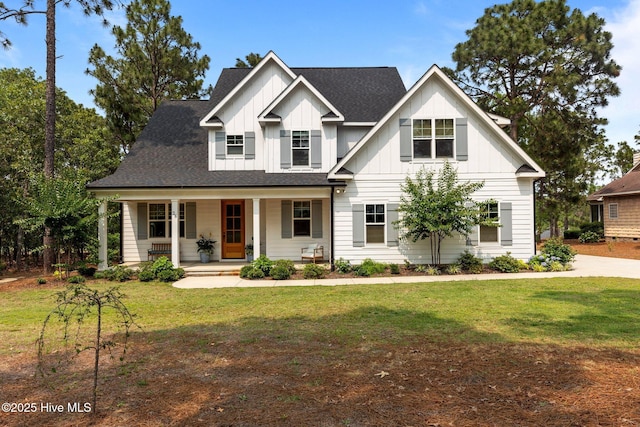 28 Kahkwa Trl, Pinehurst, NC 28374 - view of front of home featuring board and batten siding, covered porch, a front yard, and a shingled roof