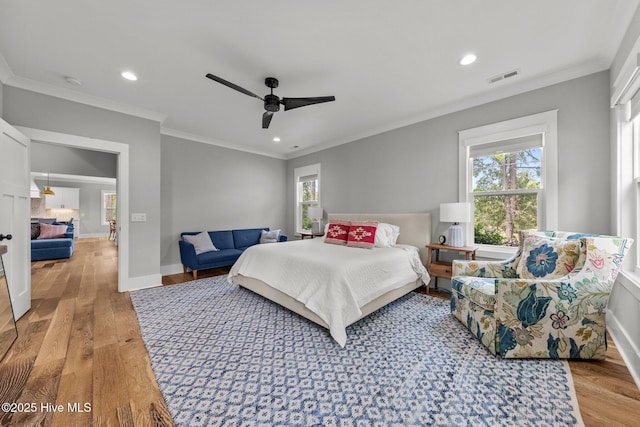 28 Kahkwa Trl, Pinehurst, NC 28374 - bedroom with light wood-style flooring, multiple windows, recessed lighting, crown molding, and ceiling fan