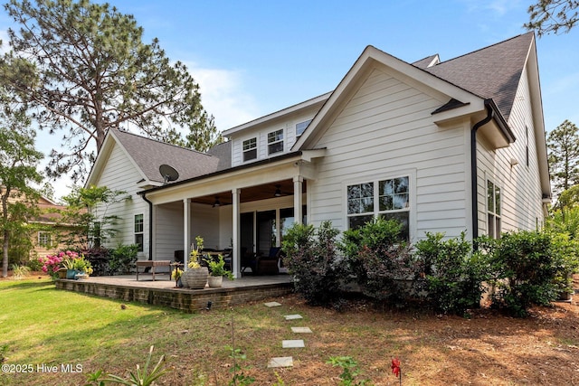 28 Kahkwa Trl, Pinehurst, NC 28374 - rear view of property featuring a ceiling fan, a patio area, a yard, and a shingled roof