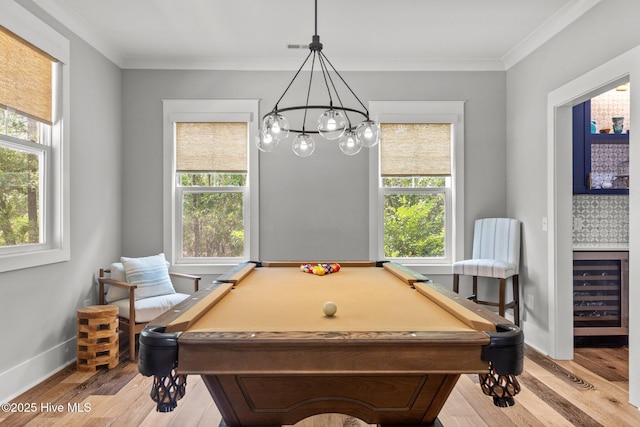 28 Kahkwa Trl, Pinehurst, NC 28374 - recreation room with wine cooler, plenty of natural light, wood finished floors, and crown molding