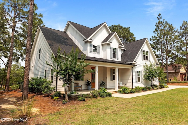 28 Kahkwa Trl, Pinehurst, NC 28374 - modern inspired farmhouse with covered porch, a front yard, board and batten siding, and roof with shingles