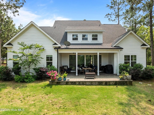 28 Kahkwa Trl, Pinehurst, NC 28374 - rear view of house with a lawn, roof with shingles, and a patio area