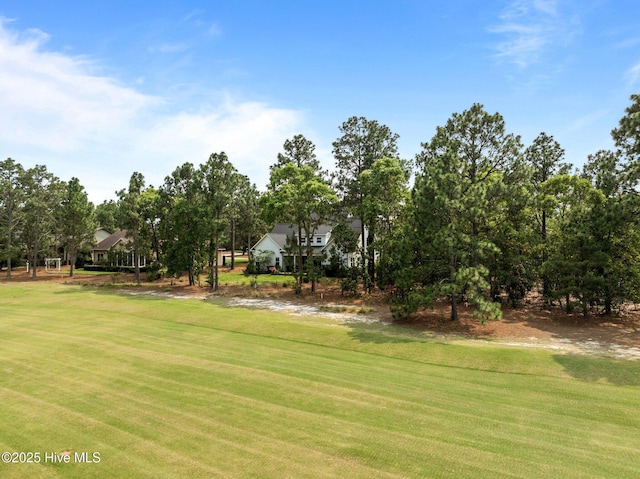 28 Kahkwa Trl, Pinehurst, NC 28374 - surrounding community featuring a lawn and view of scattered trees