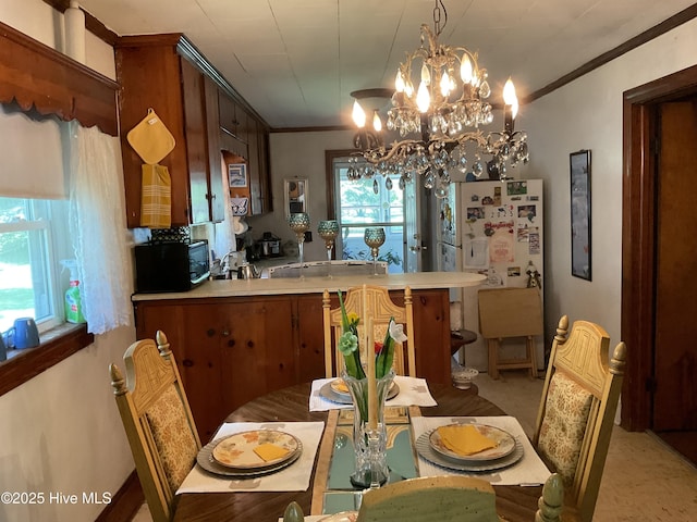 309 Battle Dr, Nashville, NC 27856 - dining area featuring crown molding and a chandelier