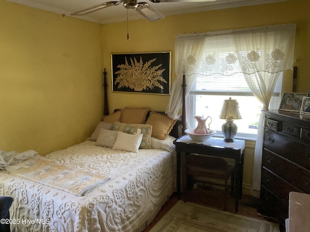 309 Battle Dr, Nashville, NC 27856 - bedroom with crown molding, a ceiling fan, and wood finished floors