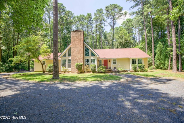457 Loblolly Dr, Vass, NC 28394 - view of front of house featuring a chimney and gravel driveway