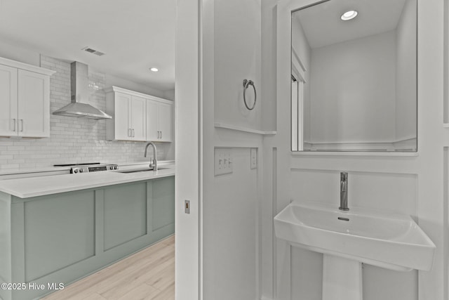 207 Spartanburg Ave Unit 1 & 2, Carolina Beach, NC 28428 - bathroom featuring wood finished floors, backsplash, and recessed lighting