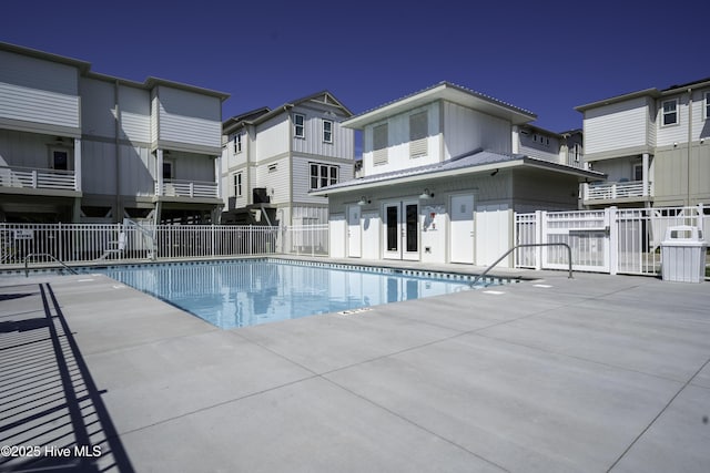 207 Spartanburg Ave Unit 1 & 2, Carolina Beach, NC 28428 - community pool with a patio area and french doors
