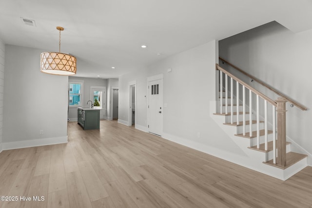207 Spartanburg Ave Unit 1 & 2, Carolina Beach, NC 28428 - entryway featuring light wood-type flooring, recessed lighting, and stairway