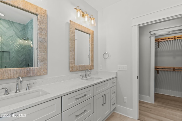 207 Spartanburg Ave Unit 1 & 2, Carolina Beach, NC 28428 - full bath with double vanity, a stall shower, wood finished floors, and a walk in closet